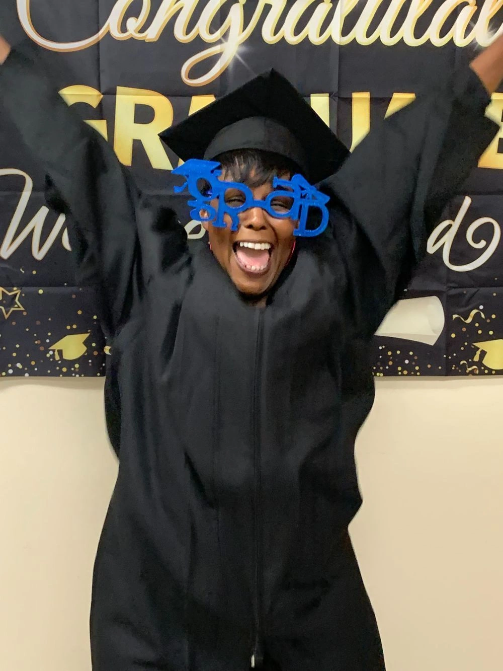 {{ school.name }} graduate showing excitement about completing the program {{ school.name }} graduate showing excitement about completing the program
