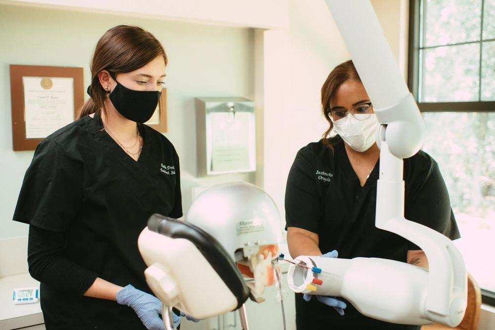 {{ school.name }} students training to capture dental x-rays {{ school.name }} students training to capture dental x-rays